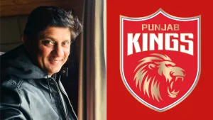Sairaj Bahutule smiling in a leather jacket next to the official Punjab Kings IPL team logo featuring a roaring lion on a red shield background.