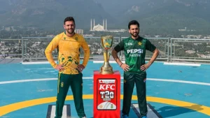 Pakistan cricketer Salman Ali Agha and South African T20 captain pose with KFC T20 series trophy with Faisal Mosque in the background
