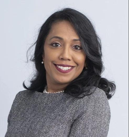 Sharda Veeren-Chand, Head of Marketing at Guyana-based Demerara Distillers Limited, posing in formal attire with a confident smile.