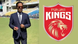 Former Indian cricketer Sunil Joshi standing on a cricket field next to the Punjab Kings (PBKS) logo