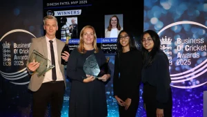 Group photo of Dinesh Patel MVP 2025 award winners at the Business of Cricket Awards, featuring honorees holding trophies in front of the event backdrop.