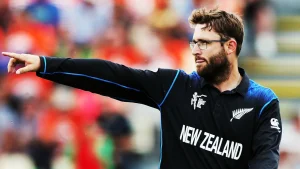 Daniel Vettori pointing during a match while wearing the New Zealand cricket team World Cup jersey.