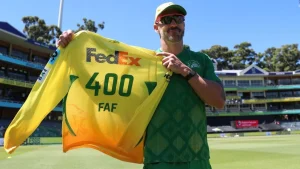 Faf du Plessis holding Joburg Super Kings jersey with number 400 during a cricket event