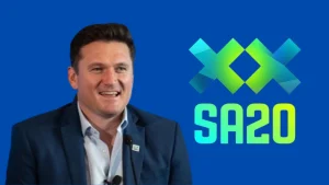 Graeme Smith speaking in front of SA20 League logo on blue background