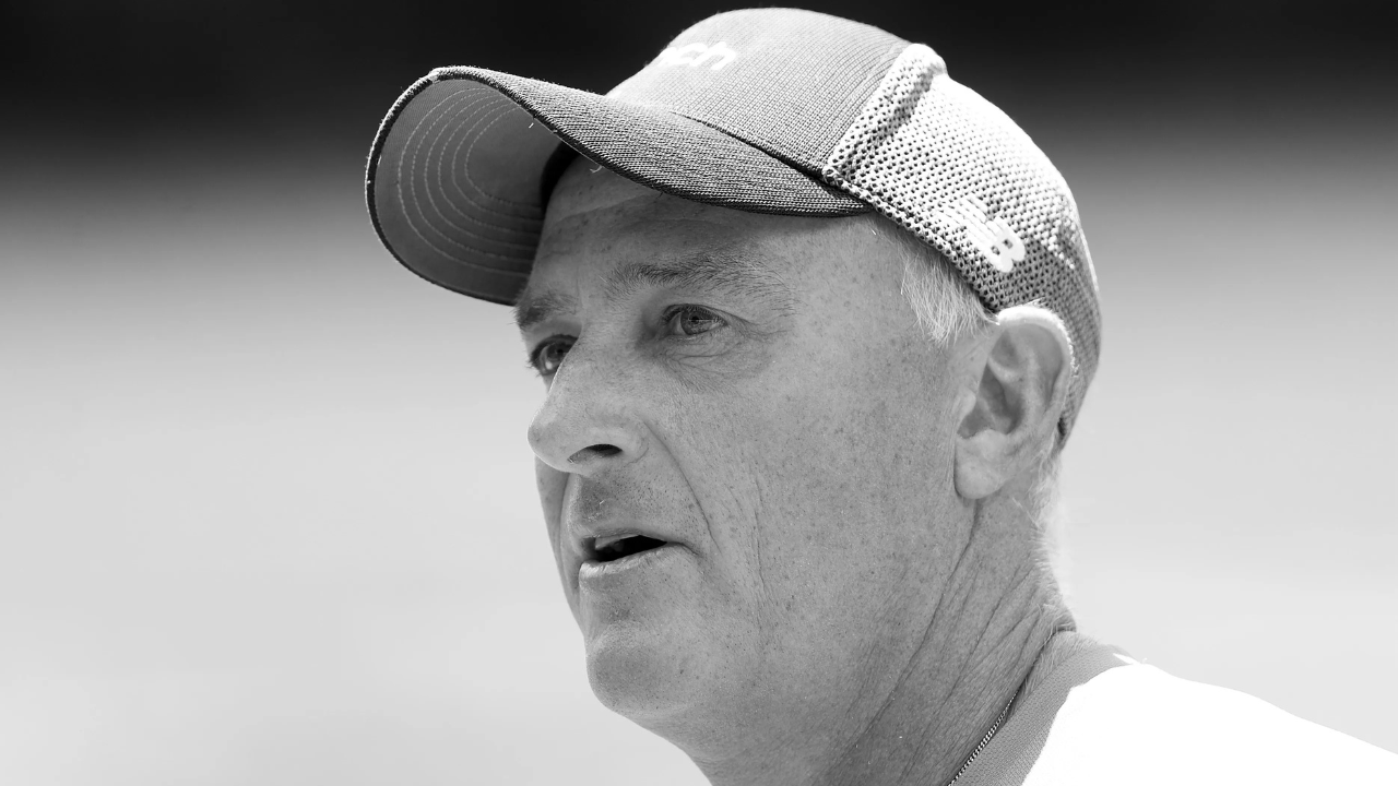 Close-up black and white portrait of former England cricketer and coach Graham Thorpe wearing a cap