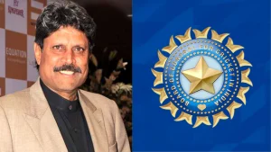 Former Indian cricket captain Kapil Dev smiling at an event, pictured alongside the official logo of the Board of Control for Cricket in India (BCCI) on a blue background.