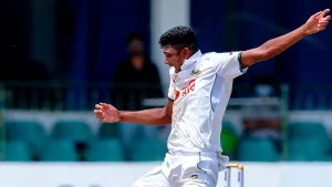 Nahid Rana in Bangladesh Test cricket jersey celebrating after delivering a ball during a match, captured mid-action on the field.