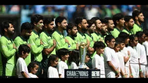 Pakistan cricket team standing for national anthem with children before ICC Champions Trophy 2025 match, trophy visible in foreground