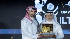 Prince Saud Bin Mishal Al-Saud and Khalid Al Zarooni presenting a Saudi Cricket trophy during a DP World ILT20 event.