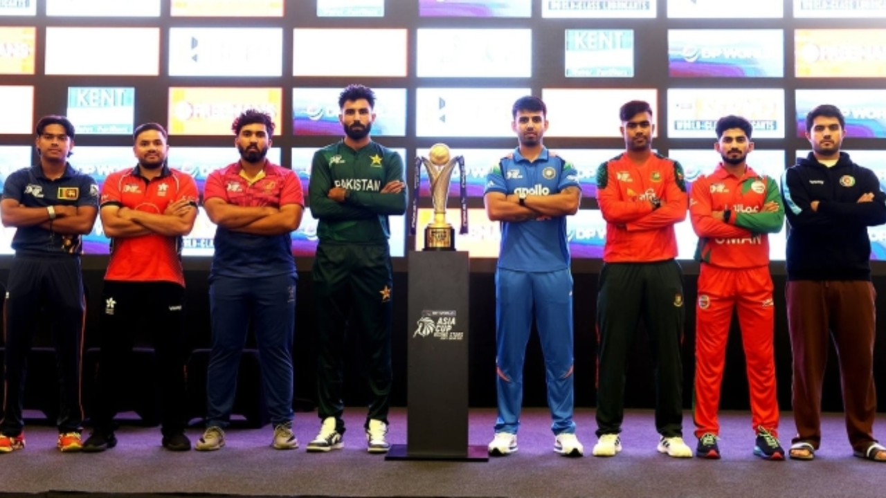 Captains from participating teams pose with the Rising Stars Asia Cup 2025 trophy during the official unveiling event, standing in team kits on stage.