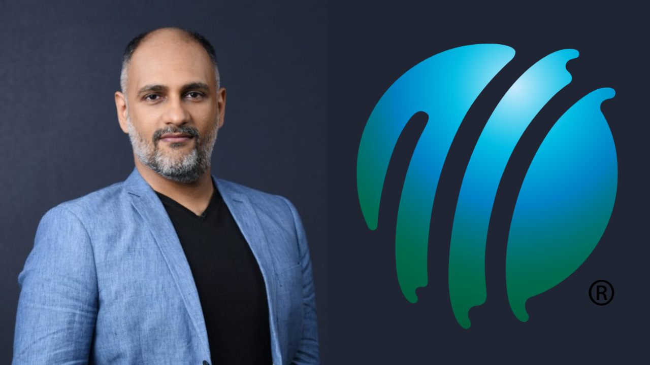 Sanjog Gupta posing in a blue blazer beside the official ICC (International Cricket Council) logo on a dark background.
