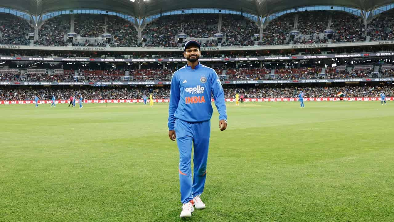 Shreyas Iyer in Indian cricket team jersey walking on the field during an international match
