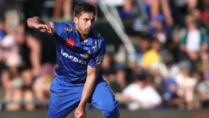 Thomas Kaber in MI Cape Town jersey bowling during a SA20 League match with a crowd in the background