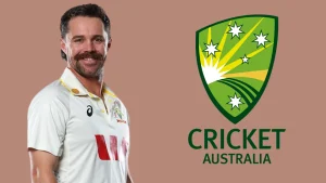 Australian cricketer Travis Head in test jersey next to the Cricket Australia logo on a brown background