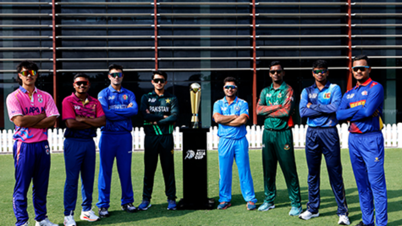 U19 Asia Cup 2025 captains from eight participating nations posing together with the tournament trophy on a cricket field.