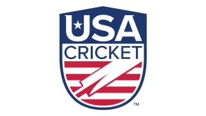 Official logo of USA Cricket featuring a shield design with bold “USA” lettering, a star, and red stripes forming a cricket bat motif.