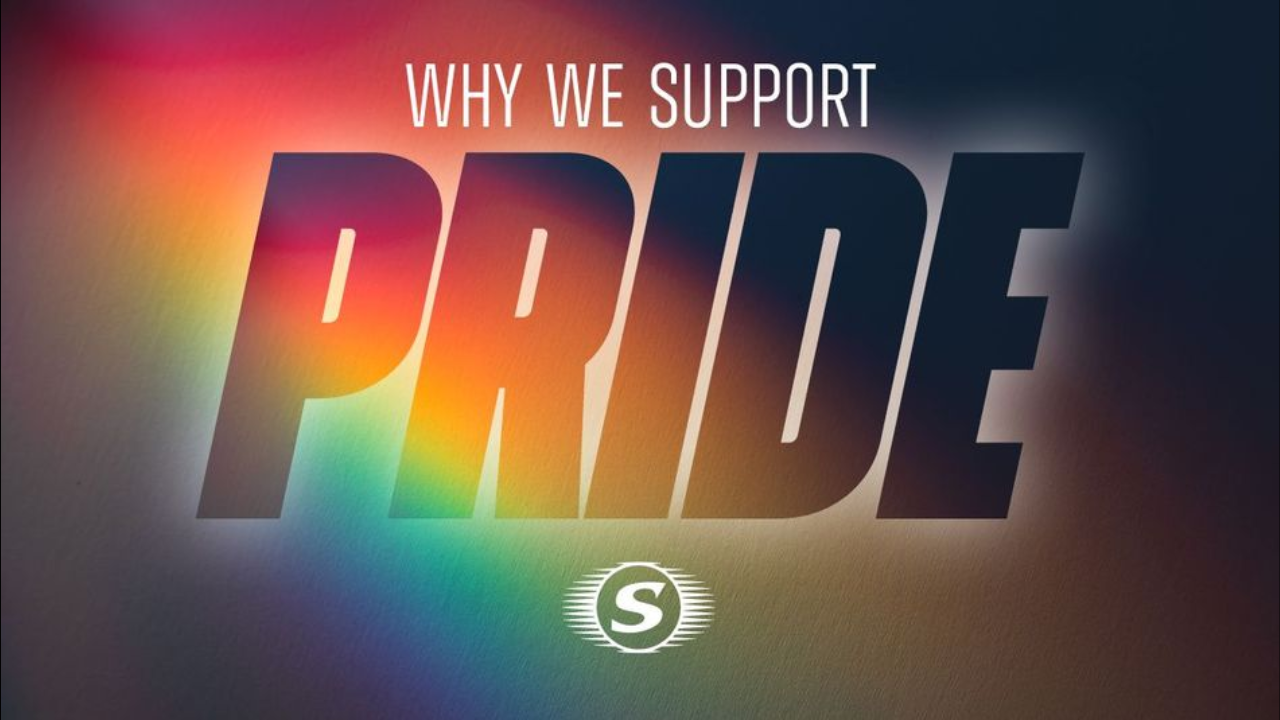 Graphic with rainbow light effect and bold text reading "Why We Support PRIDE"