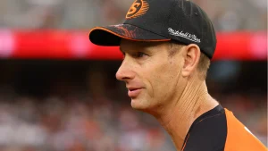 Close-up of Adam Voges wearing a Perth Scorchers cap during a Big Bash League match, focused on the field.