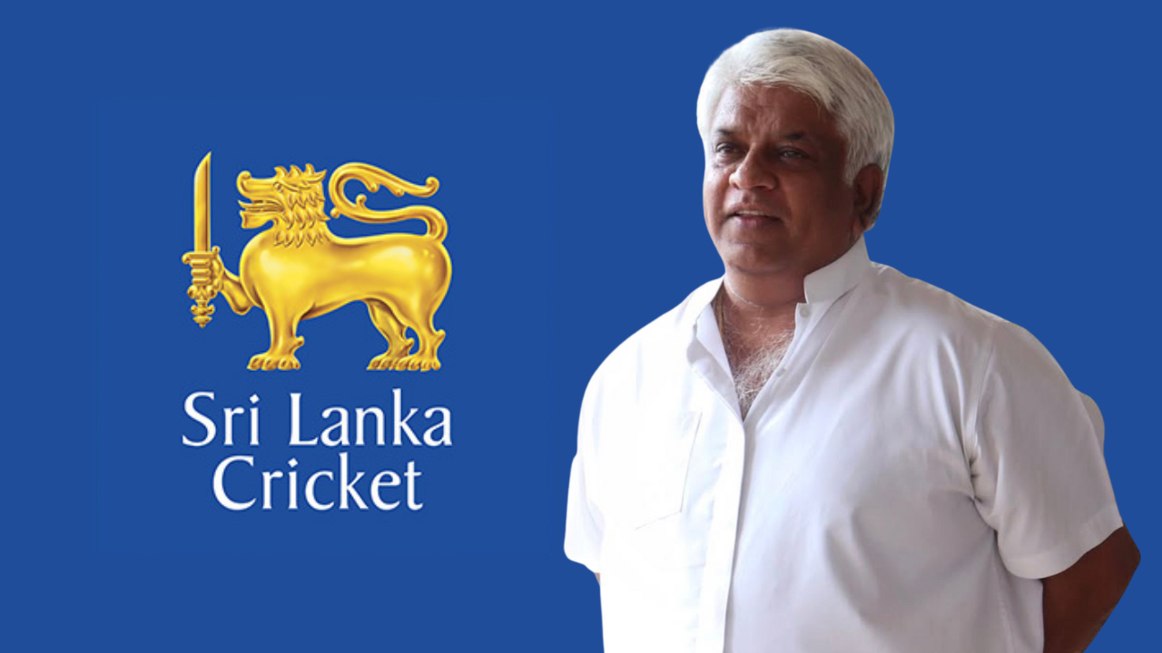 Arjuna Ranatunga standing beside the Sri Lanka Cricket logo on a blue background