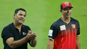 Azhar Mehmood and Waqar Younis during an ILT20 match, with Mehmood in Desert Vipers jersey and Younis in black polo shirt