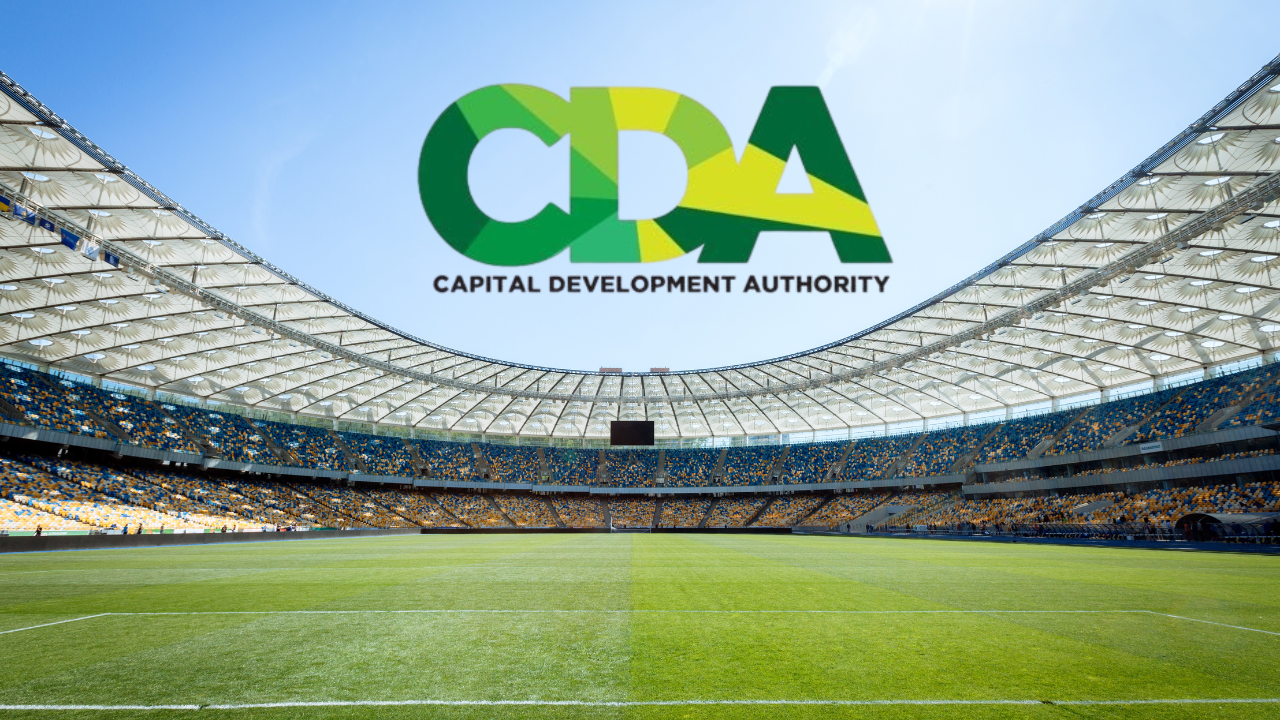 Modern cricket stadium with the Capital Development Authority (CDA) logo displayed above the stands