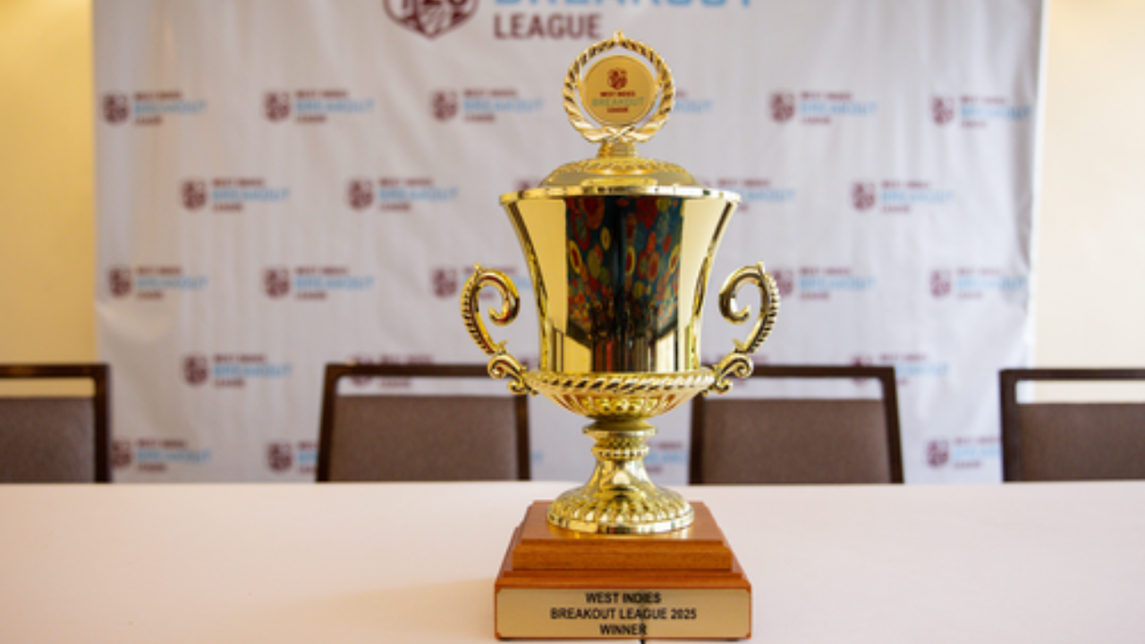 Golden trophy awarded to the winner of the West Indies Breakout T20 League 2025 displayed on a table with league branding in the background.