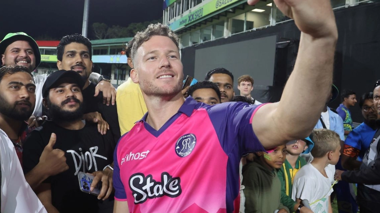 David Miller takes a selfie with fans while wearing Paarl Royals jersey after a cricket match in 2025.