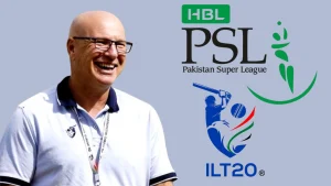 Cricket executive David White smiling beside the logos of Pakistan Super League (PSL) and International League T20 (ILT20).