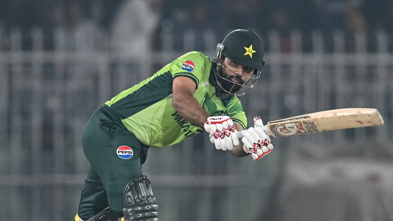 Fakhar Zaman playing a shot during an ODI match for Pakistan, wearing the national green jersey and helmet