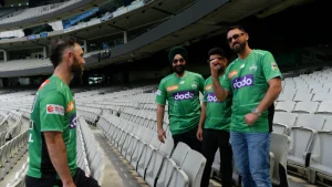 Glenn Maxwell in Melbourne Stars jersey interacting with Bharat Army fans in the stadium stands
