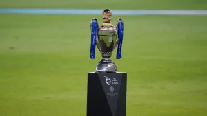 ILT20 cricket trophy displayed on a podium at the stadium ahead of the championship match