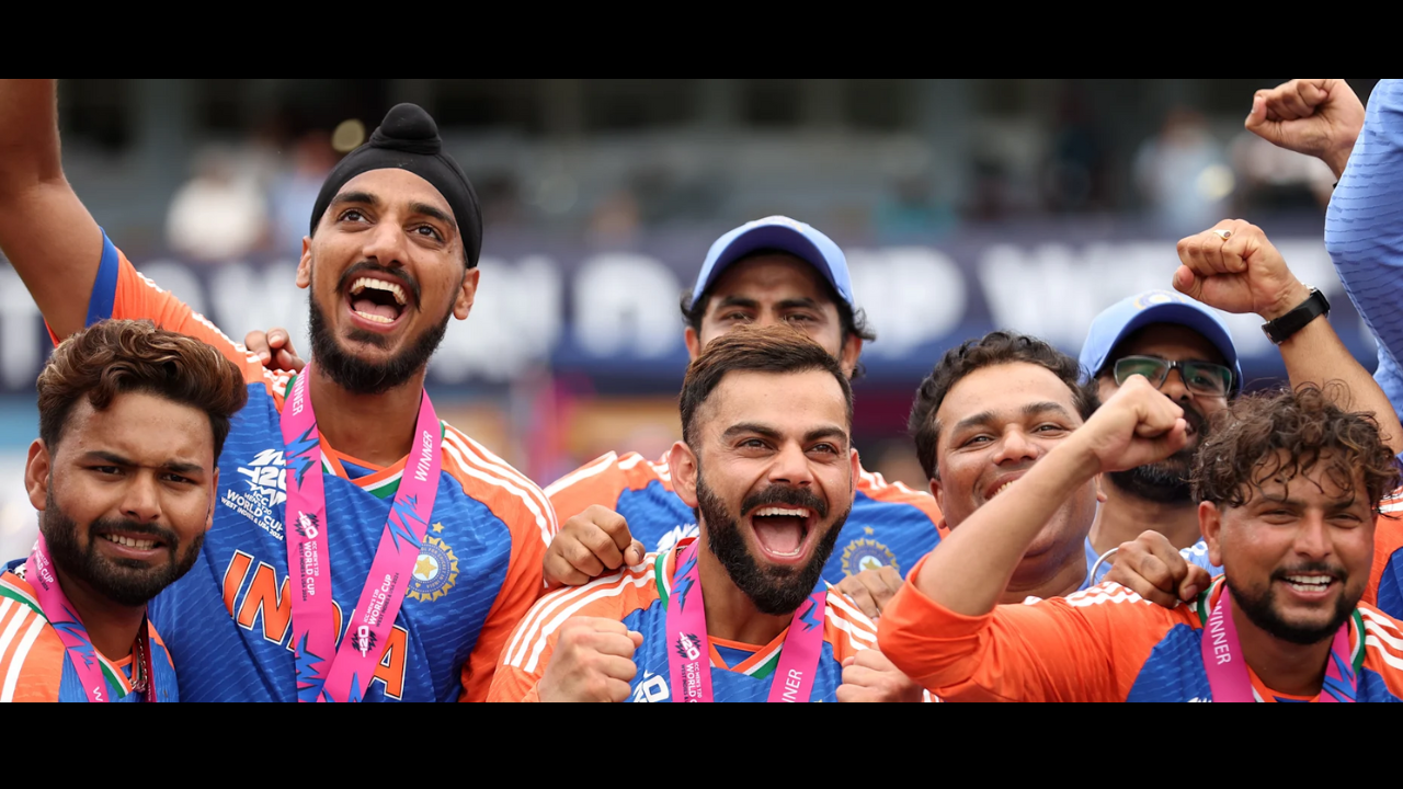 Indian men’s cricket team celebrates winning the ICC T20 World Cup 2024, with players cheering and wearing winner medals.