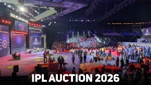 View of the IPL Auction 2026 at Etihad Arena with team tables, stage setup, and attendees preparing for the player auction