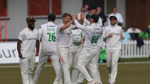 Leicestershire County Cricket Club players celebrating a wicket during a match in the 2025 season.