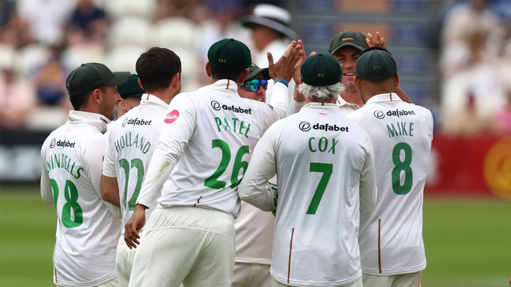 Leicestershire County Cricket Club players celebrating a wicket during a 2025 County Championship match.