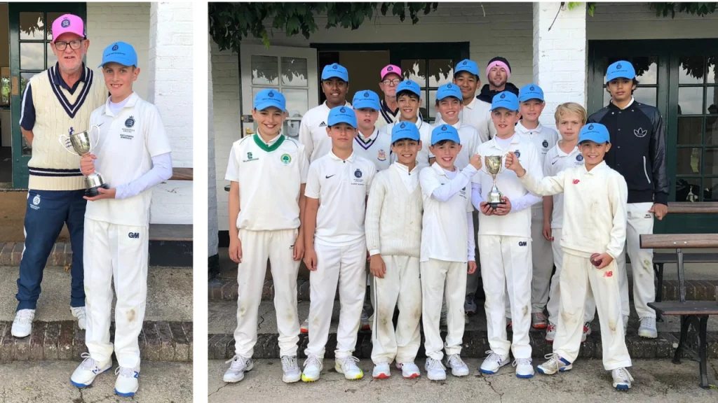 Young cricketers wearing Middlesex County Cricket Club kits celebrating with a trophy outside a pavilion