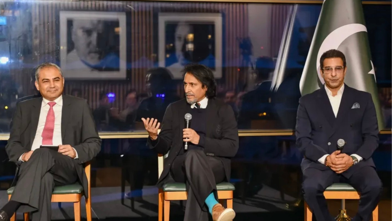 Mohsin Naqvi, Ramiz Raja, and Wasim Akram speaking at the PSL Roadshow event in London with a Pakistan flag in the background
