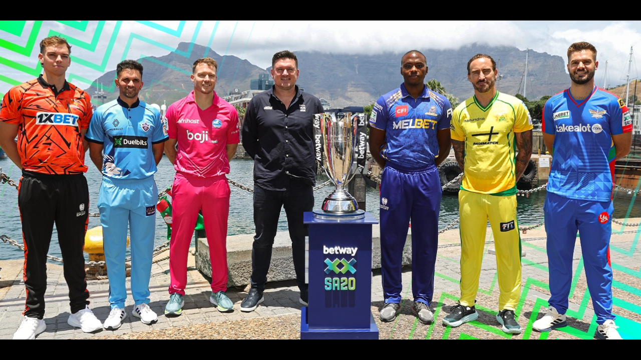 Graeme Smith stands with SA20 team representatives including Aiden Markram, Faf du Plessis, Kagiso Rabada, David Miller, Keshav Maharaj and Tristan Stubbs during a league trophy photo event.