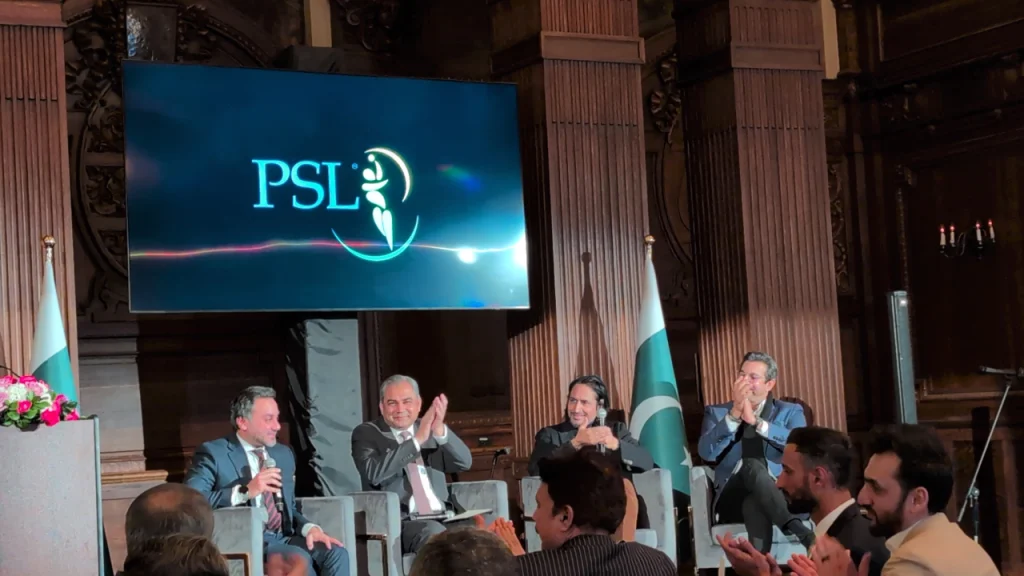 Salman Naseer, PCB Chairman Mohsin Naqvi, Ramiz Raja, and Wasim Akram on stage during the PSL Roadshow 2025 in New York, with Pakistan flags and PSL logo displayed in the background.