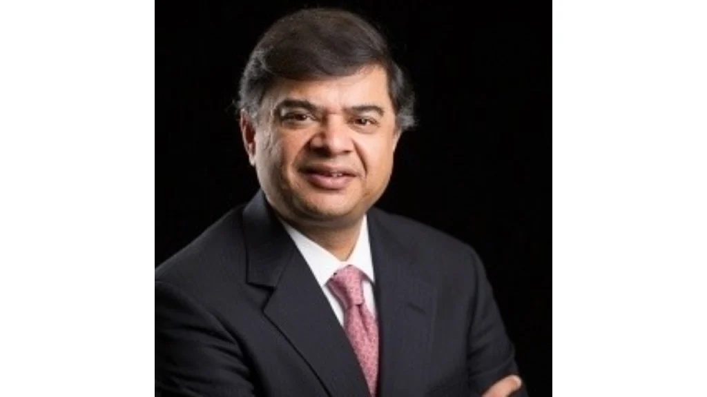 Sanjay Govil, owner of Washington Freedom cricket team, in a professional portrait wearing a suit and tie