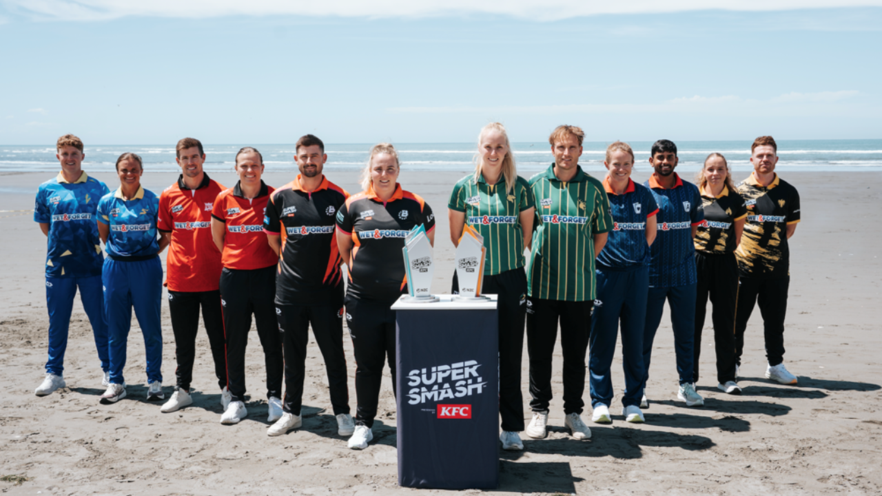 Super Smash 2025 team captains posing with men's and women's trophies on a beach in New Zealand ahead of the tournament