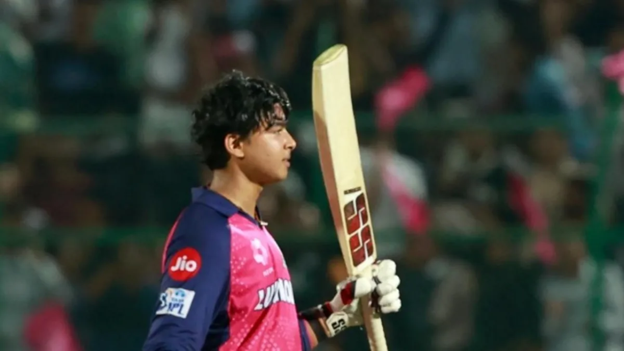 Vaibhav Sooryavanshi in Rajasthan Royals jersey holding a cricket bat during an IPL 2025 match.