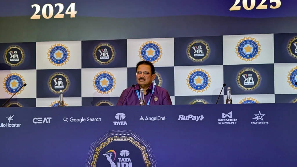 Venky Mysore, CEO of Kolkata Knight Riders, addressing the media during IPL auction press conference with BCCI and IPL logos in the background