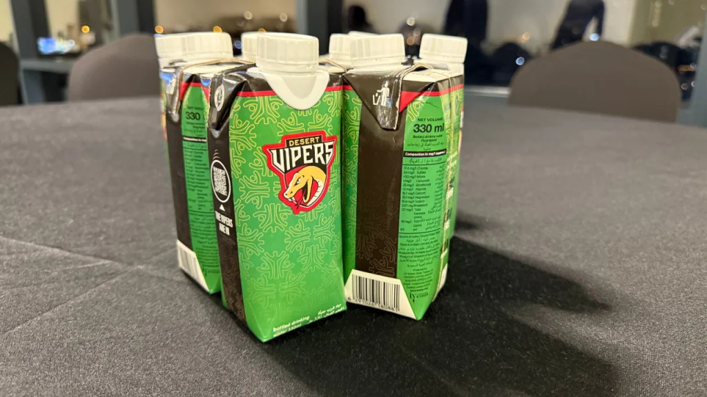 Desert Vipers branded 330ml sustainable water cartons displayed on a table during ILT20 2026 event