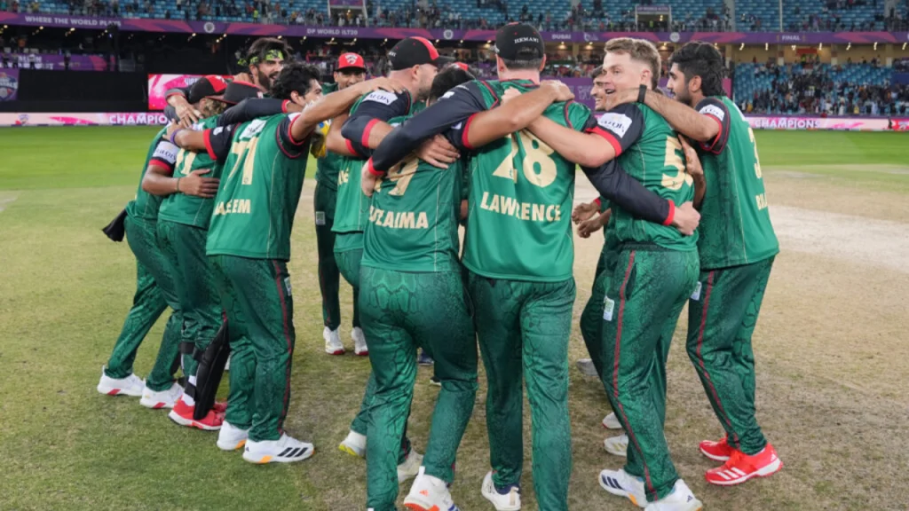 Desert Vipers players in a celebratory team huddle after winning the ILT20 2026 final at Dubai International Stadium