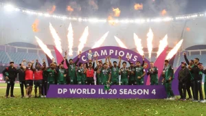 Desert Vipers players celebrate winning DP World ILT20 Season 4 championship with trophy and fireworks during the post-match ceremony.
