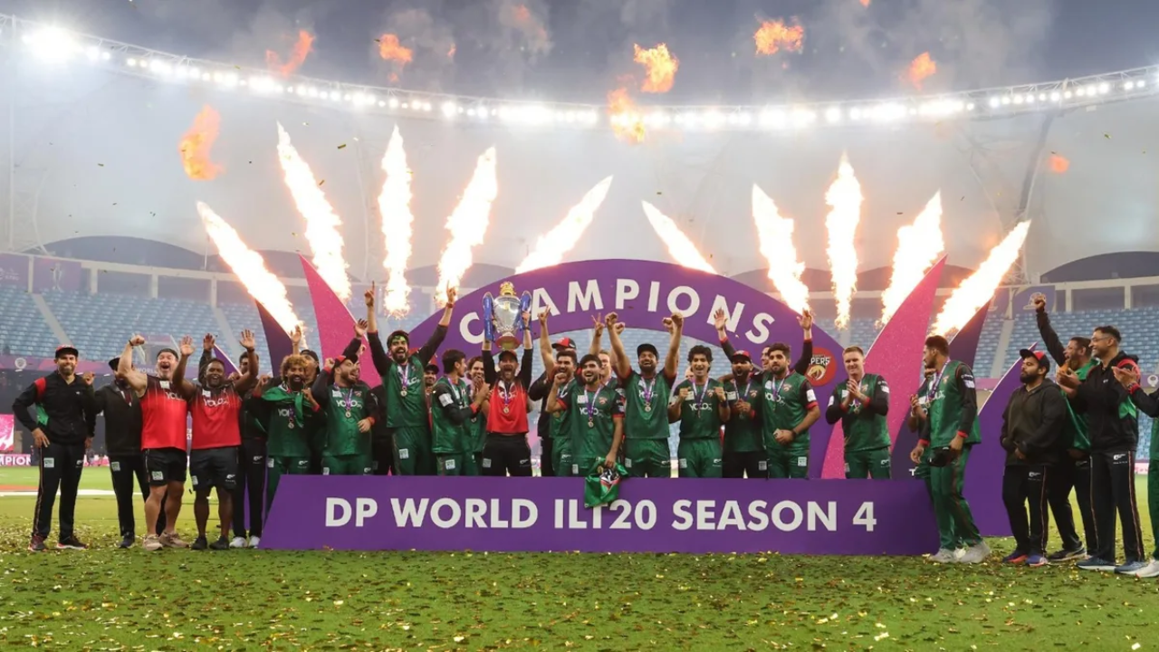 Desert Vipers players celebrate winning DP World ILT20 Season 4 championship with trophy and fireworks during the post-match ceremony.