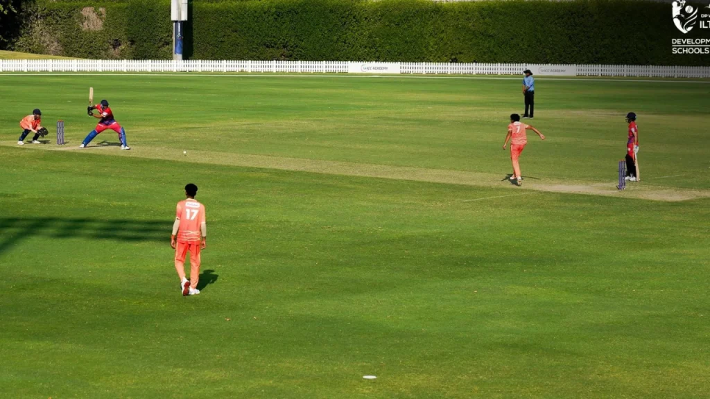 Young cricketers playing in the DP World ILT20 Schools Cup 2025 at the ICC Academy ground