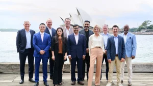 ETPL league officials including Steve Waugh, Abhishek Bachchan, and Kyle Mills pose for a group photo in front of the Sydney Opera House in 2026.