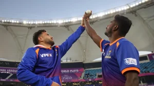Fazalhaq Farooqi in MI Emirates jersey guiding a fellow bowler during a training session at the ILT20 tournament in Dubai.